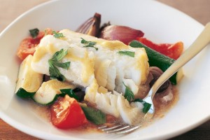 Baked fish on vegetables
