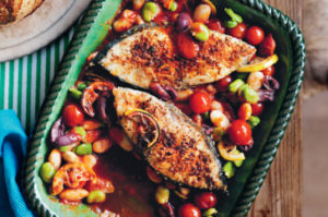 Baked fish with tomatoes, beans and olives
