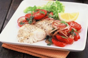 Barbecued fish with warm tomato salad