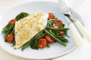 Lemon fish with sautéed beans and tomatoes