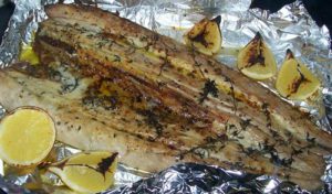 Grilled snoek with green salsa