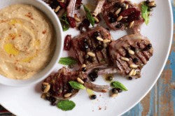 Grilled lamb cutlets with olives, mint and white bean puree