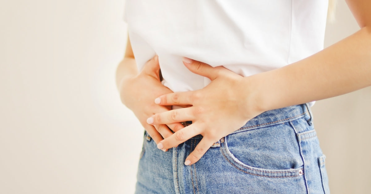 woman holding her stomach