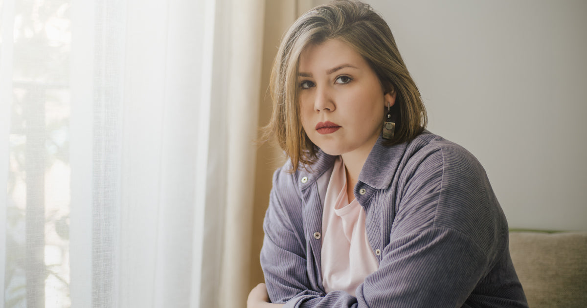 Lady sitting at a window 