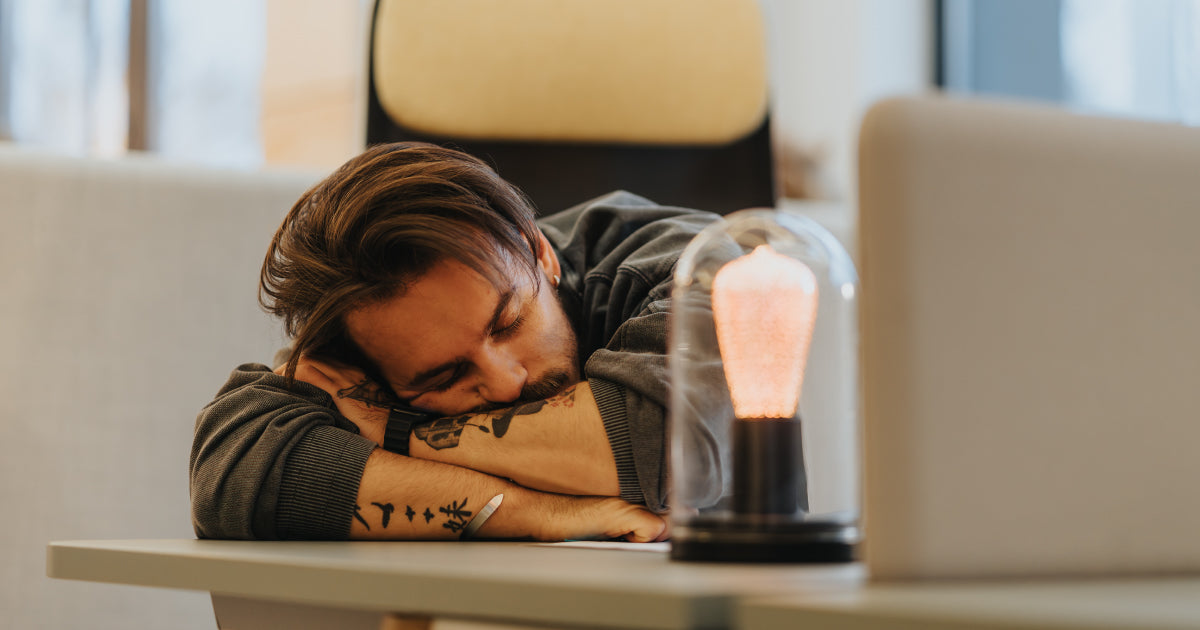 Person lying on their arms, tired.