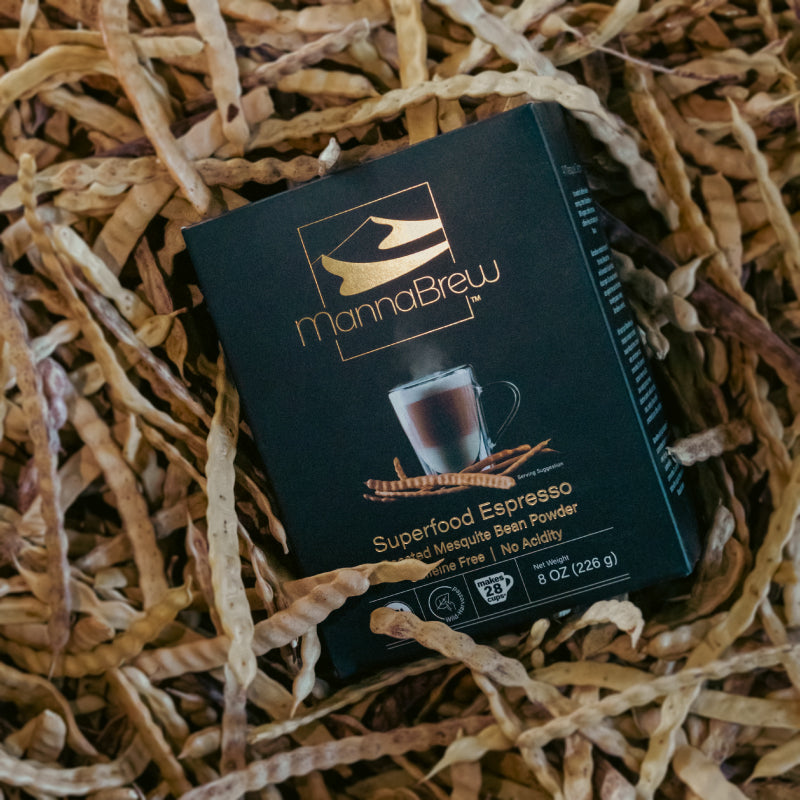 MannaBrew Superfood Espresso package in a bunch of mesquite pods.